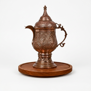 Théière en cuivre antique avec motif floral gravé sur base en bois - Product Image 1