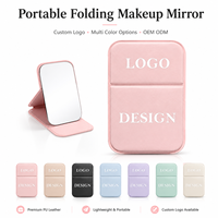 Miroir de maquillage pliable portable avec logo personnalisé, miroir de vanité compact avec housse en PU, options multicolores pour les voyages, les cadeaux et l'usage quotidien