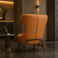Fauteuil d'angle de luxe en cuir cognac, ergonomique, capitonné, à dossier haut, pour lecture, avec pieds en métal, idéal pour salon de penthouse