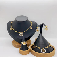 Plaqué or 18 carats collier en os de serpent boucle fleur pendentif collier boucles d'oreilles bracelet bague en acier inoxydable ensemble de bijoux pour femmes