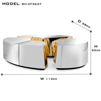 Table basse contemporaine inspirée des formations karstiques avec finition laiton poli et acier miroir, meubles de salon