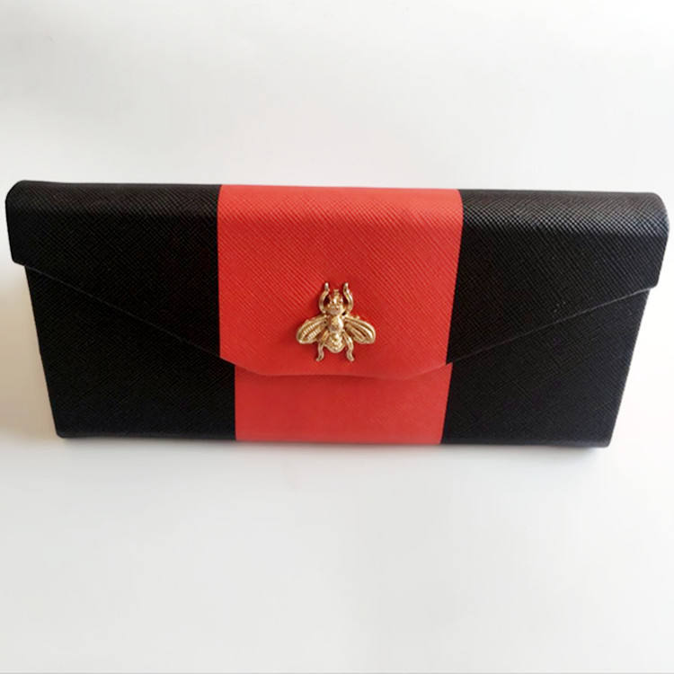 Design élégant d'abeille en rouge et noir