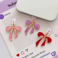 Breloques anti-poussière pour téléphone avec nœud mignon, pendentifs décoratifs en émail en forme de nœud pour port de charge USB-C, accessoires décoratifs