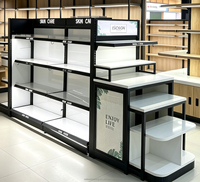 Étagères gondoles métalliques double face robustes pour présentation de cosmétiques, idéales pour les salons de beauté et les magasins de maquillage