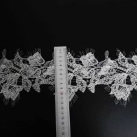 Nouvelle dentelle brodée en acrylique et polyester avec motifs floraux en relief pour robes de mariée et manches de chemisiers