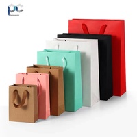 Fabricant Vente en gros Emballage en carton personnalisé Sacs en papier pour cadeaux Sac à provisions en carton personnalisé Votre propre logo