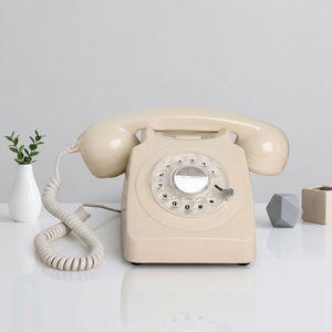 Téléphone fixe filaire classique style années 60, couleur crème antique, avec sonnerie mécanique et fonction de recomposition - Product Image 1