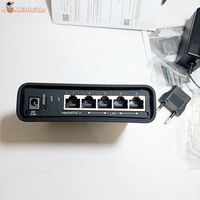 Point d'accès WiFi MikroTik RBD52G-5HacD2HnD-TC HAP Ac double simultané 2.4G et 5G avec cinq ports Ethernet Gigabit pour une utilisation FTTH