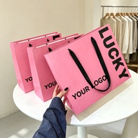Sacs en papier de courses robustes personnalisés avec logo, en matériaux recyclés écologiques, avec poignées en ruban de satin noir pour vêtements – Vente en gros