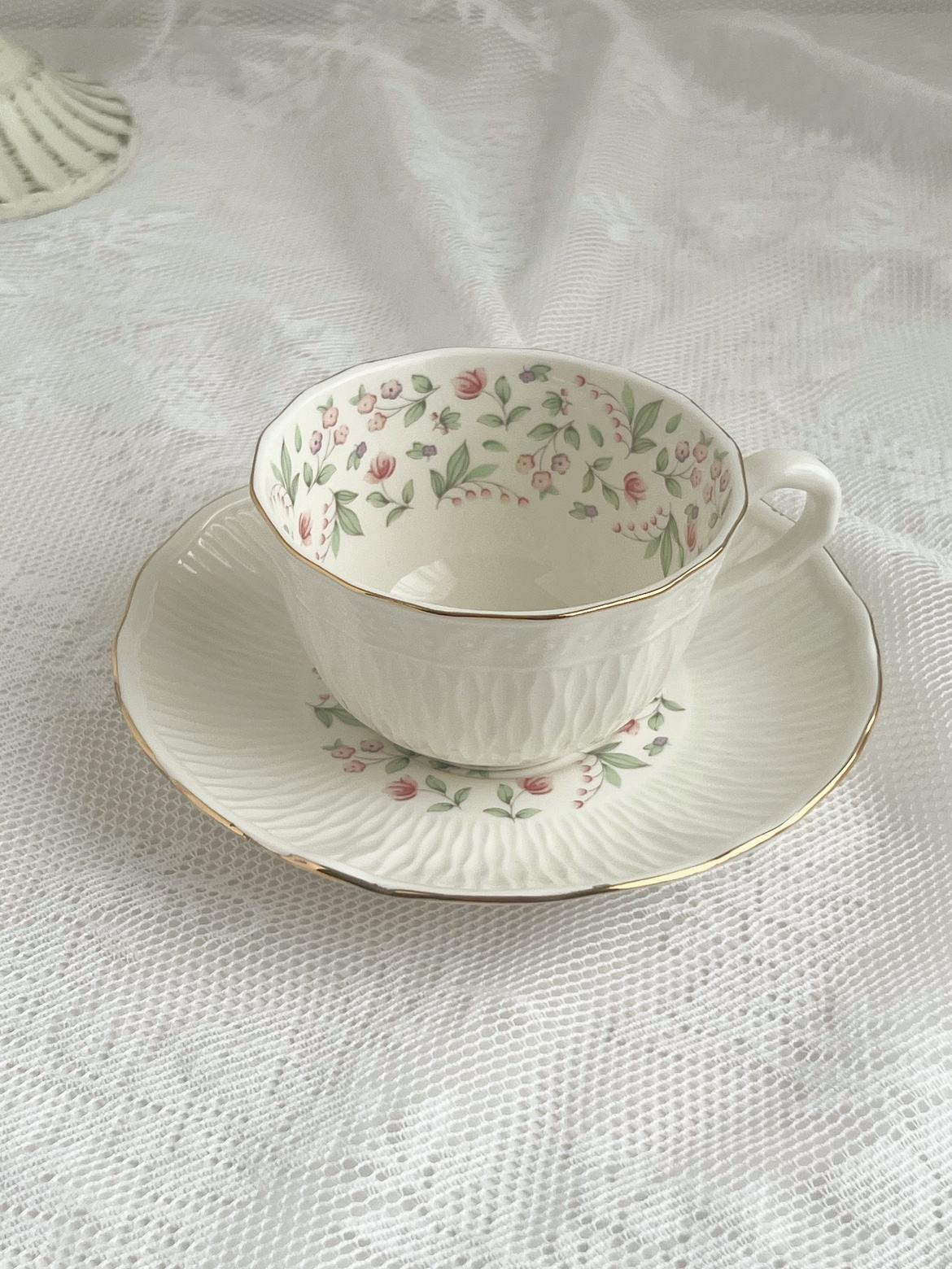Pink coffee cup and saucer
