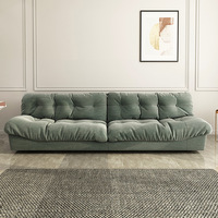 Canapé Cloud, style italien minimaliste, tissu technique givré, rembourrage en duvet, pour petit appartement ou salon.