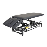 Table de traitement de décompression vertébrale de massage chiropratique de physiothérapie électrique réglable avec conception pliable en éponge PU