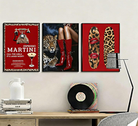 Décoration murale Trio de bottes rouges léopard encadrées d'un cadre noir mat mince pour projet de lieux de divertissement (bars et salons) pour femmes d'Amérique du Nord