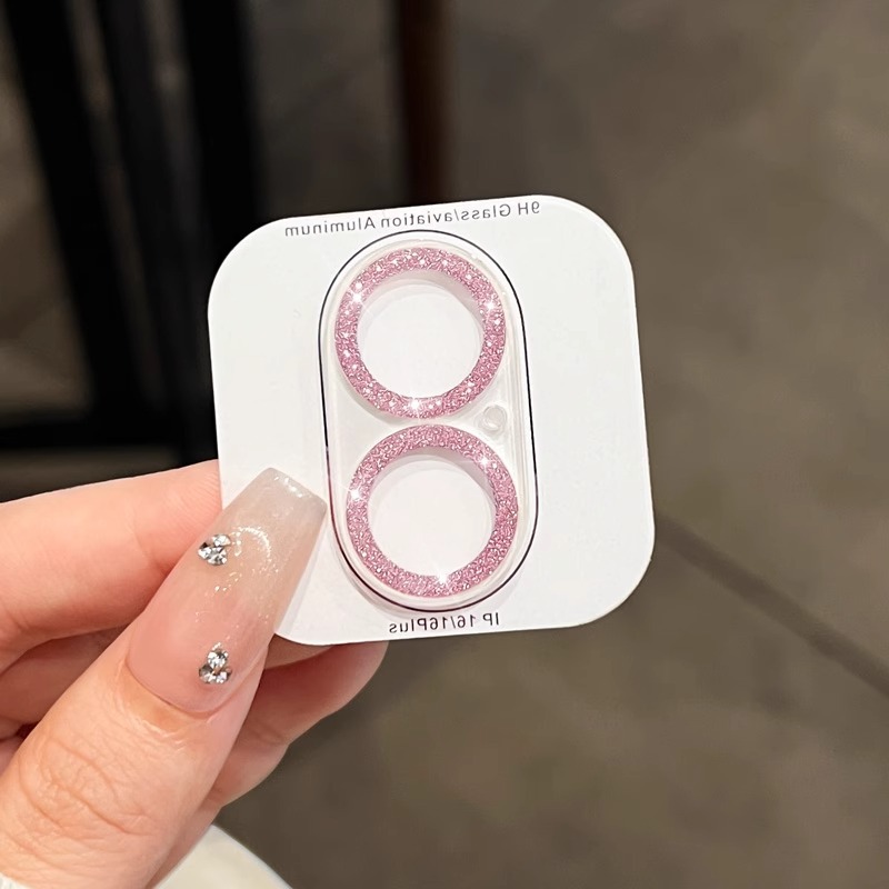 Película protectora de lente todo en uno con brillo rosa.