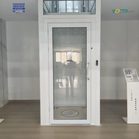 Ascenseur de cabine à porte métallique moderne à commande manuelle pour petite villa, usage domestique, marque Vectr, garantie 1 an, porte à commande manuelle