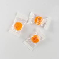 Bonbons ronds en gros à motif imprimé, bonbons fourrés saveur orange, bonbons colorés pour enfants et friandises de fête en vrac OEM