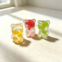 Jouet anti-stress en forme d'ours mignon en gelée transparente à l'huile de coco, avec tranche de fruit à l'intérieur, souple et extensible