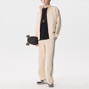 Ensemble de survêtement décontracté et confortable en coton épais à rayures pour homme, avec veste et pantalon large à jambes larges, idéal pour le sport et les loisirs. - Product Image 4