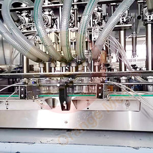 12 buses huile lubrifiante peser la distribution de liquide 2 têtes jus bière bouteille en verre machine de remplissage volumétrique avec capsuleuse 1 ensemble - Product Image 3