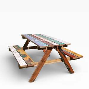 Découvrez une élégance intemporelle avec cette table de pique-nique d'extérieur en teck rustique, de 150x70x78 cm, fabriquée en bois durable. - Product Image 1