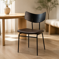 Fauteuil Bauhaus rétro en bois grainé noir, dossier incurvé, assise en cuir PU marron, structure en métal doré, mobilier de maison rembourré durable