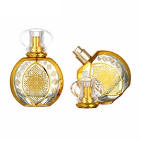 Flacon de parfum rond en verre doré de luxe de haute qualité 50 ml avec diffuseur à bâtonnets, bouchon à vis, gravure et sérigraphie, livraison rapide