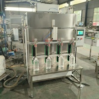 Machine de remplissage de liquides semi-automatique à 4 têtes, à alimentation par gravité, pour spiritueux, liqueurs, alcool, vin