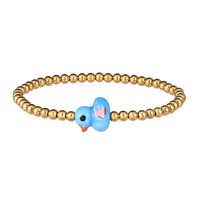 Bracelet extensible en acier inoxydable inaltérable avec perles dorées, motif animal mignon et perles en céramique colorées en forme de petit canard, pour filles