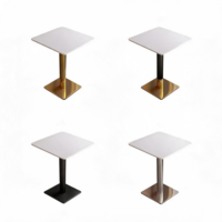 Table à manger carrée moderne de luxe en marbre blanc mat avec base noire dorée pour restaurant, hôtel, café, appartement
