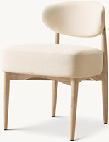 Chaise de salle à manger en chêne massif, style tubulaire moderne, avec pieds coniques élancés de style sculptural et assise rembourrée en tissu moelleux