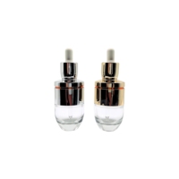Flacons compte-gouttes d'huile essentielle en verre rond de luxe de 50ml plaqué or argent épaule pour crème pour les yeux sérum cosmétique