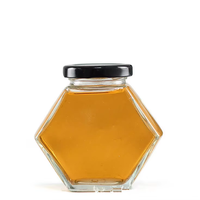 Best-seller pot à miel en verre pot à miel unique avec louche en bois pot hexagonal en verre pour miel 100ml 220ml 380ml en stock
