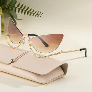 Lunettes de soleil de luxe sans monture œil de chat pour femmes avec strass, protection UV400, pare-soleil de classe 2, monture en plastique et métal - Product Image 1