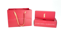 Caja de Cartón Color Marfil Personalizada para Ropa, Bolsa de Papel Roja con Logotipo de Nutria Dorada, Laminado Mate con Asa para Empaque de Prendas
