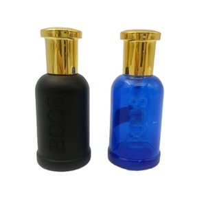 OEM OEM OEM Vente à chaud Nouveau flacon de parfum en verre bleu cylindrique en forme de <span class=keywords><strong>cloche</strong></span> de 50ml avec couvercles pulvérisateurs dorés - Product Image 1