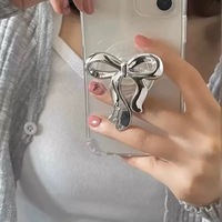 Nouvelle coque de téléphone magnétique créative en acrylique en forme de nœud avec support de préhension et support de bureau extensible style Instagram coréen pour iPhone