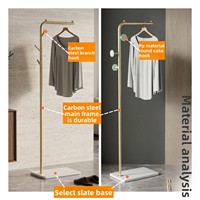 Porte-manteau sur pied en métal de style moderne et épuré, de luxe discret, avec plateau en pierre pour la maison