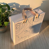 Boîte cadeau en EVA de luxe en forme de livre, avec logo en feuille d'or, texture gaufrée élégante, laminage mat pour crème pour le visage, produits de luxe personnalisés