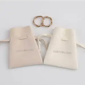 Pochette d'emballage de bijoux en velours avec logo personnalisé en gros paquet de rangement de cadeaux avec petit cordon de serrage sac de poche à cordon emballage de bijoux
