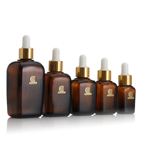 Flacon cosmétique de luxe en verre ambré carré avec compte-gouttes, 10 ml, 25 ml, 30 ml, 50 ml, 100 ml, pour sérum de soin de la peau, avec collier doré