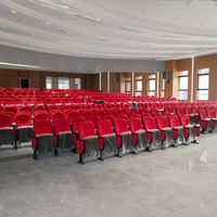 Chaise de salle de conférence scolaire avec dossier en plastique personnalisable au design moderne, structure métallique et tablette d'écriture pliable