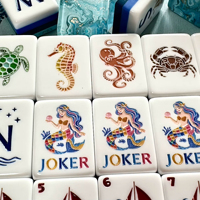 Jeu de tuiles de mahjong en acrylique de luxe américain de haute qualité, design bleu océan écologique, 144 pièces + étui en aluminium + pousseurs