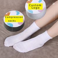 Chaussettes jetables en coton et polyester avec logo personnalisé, chaussettes de compression, emballage compressé, gain de place, sans lavage, portables, unisexes