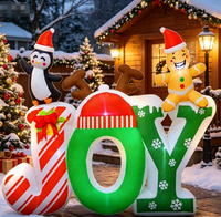 Décoration gonflable en forme de lettre style bonbon avec lumières colorées intégrées pour créer une ambiance de Noël dans la cour extérieure