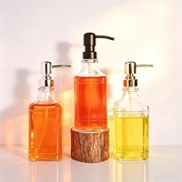 Distributeur de savon en verre ambré carré épais de haute qualité de 500 ml avec pompe manuelle en acier inoxydable noir au design moderne pour la salle de bain
