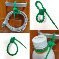 Attache-câble en silicone double trou en forme de gourde, réutilisable, multifonctionnel et coloré pour le regroupement de câbles (vente en gros)