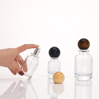 Bouteille de parfum cylindrique en verre transparent transparent raffiné 50ml avec approvisionnement en stock prêt pour pulvérisateur à pompe