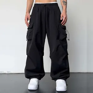 2023 ropa informal estilo Hip Hop de alta calidad pantalones Cargo holgados Unisex pantalones de paracaídas de nailon de pierna ancha personalizados para hombres
