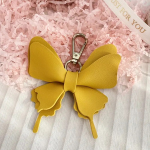 Cross-border spot PU leather bow keychain pendant ornament, fresh and colorful butterfly-shaped <b>bag</b> <b>charm</b> - Product Image 3