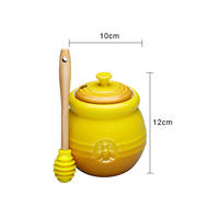 Pot de miel en céramique jaune avec louche pour le stockage des aliments et l'usine de conteneurs en gros 500ml